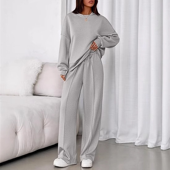 Ensemble deux pièces composé d'un sweat à capuche à manches longues uni et d'un pantalon zippé